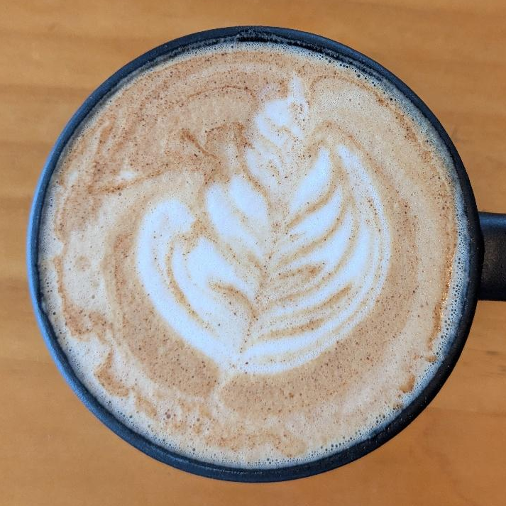 Photo of huckleberry pie oat milk latte from Loaves & Witches