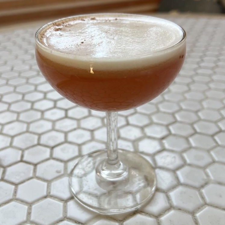 Photo of Honored Guest Mocktail - early grey tea, guava, lemon, coconut water, nutmeg from Consignment Lounge