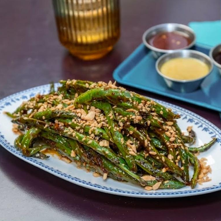 Photo of Dry-Fried Green Beans - the sauce and crispy garlic on top made them so good from Chef’s Special Cocktail Bar