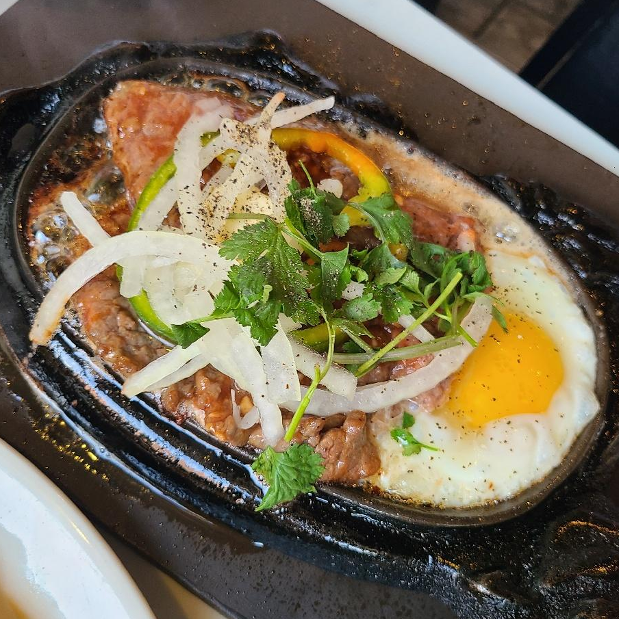 Photo of bo ne - sizzling beef (also comes w bread & fries) from Saigon Chicken House
