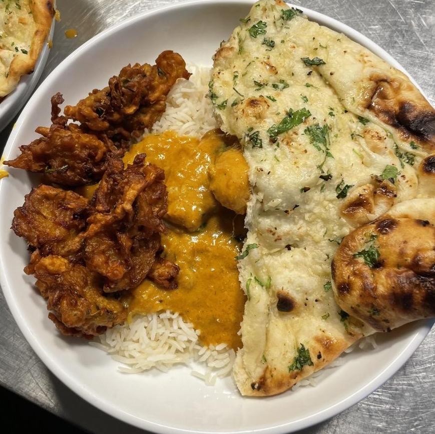 Photo of Rice, Chicken korma, vegetables pakora, garlic Naan from Shanti Restaurant - Dorchester