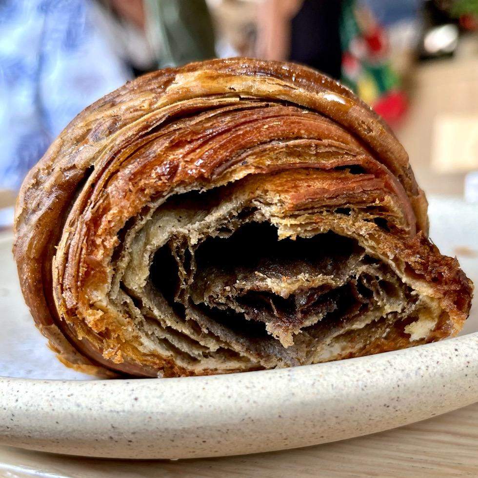 Photo of black mole croissant from Loba Pastry + Coffee