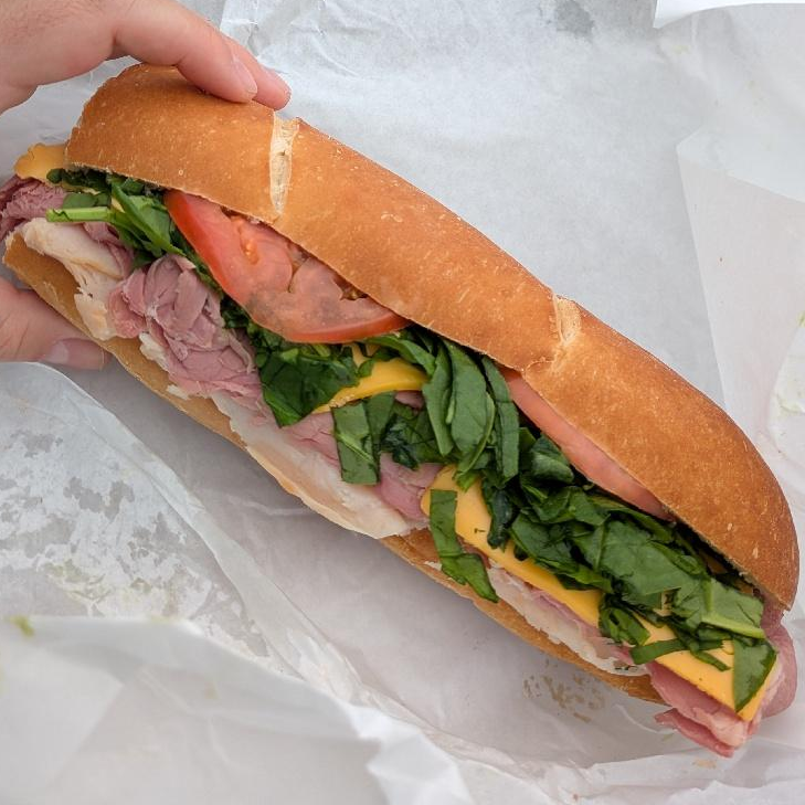 Photo of my diy sandwich: corned beef / turkey / spinach / tomato / cheese / mayo from Uptown Deli